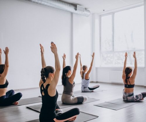 yoga-group-classes-inside-gym_1303-14788
